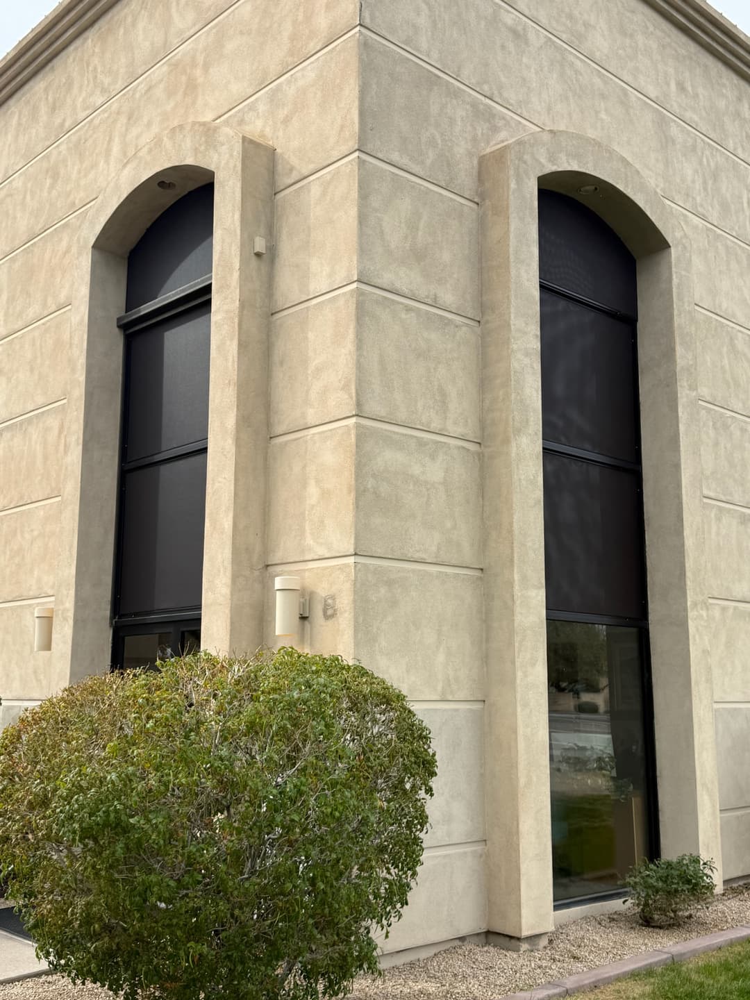 Dark exterior window shades on a Phoenix commercial building
