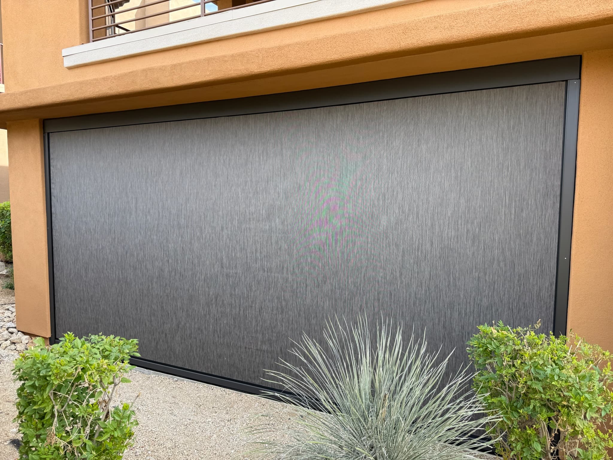 Exterior shade lowered beside a Phoenix pool patio