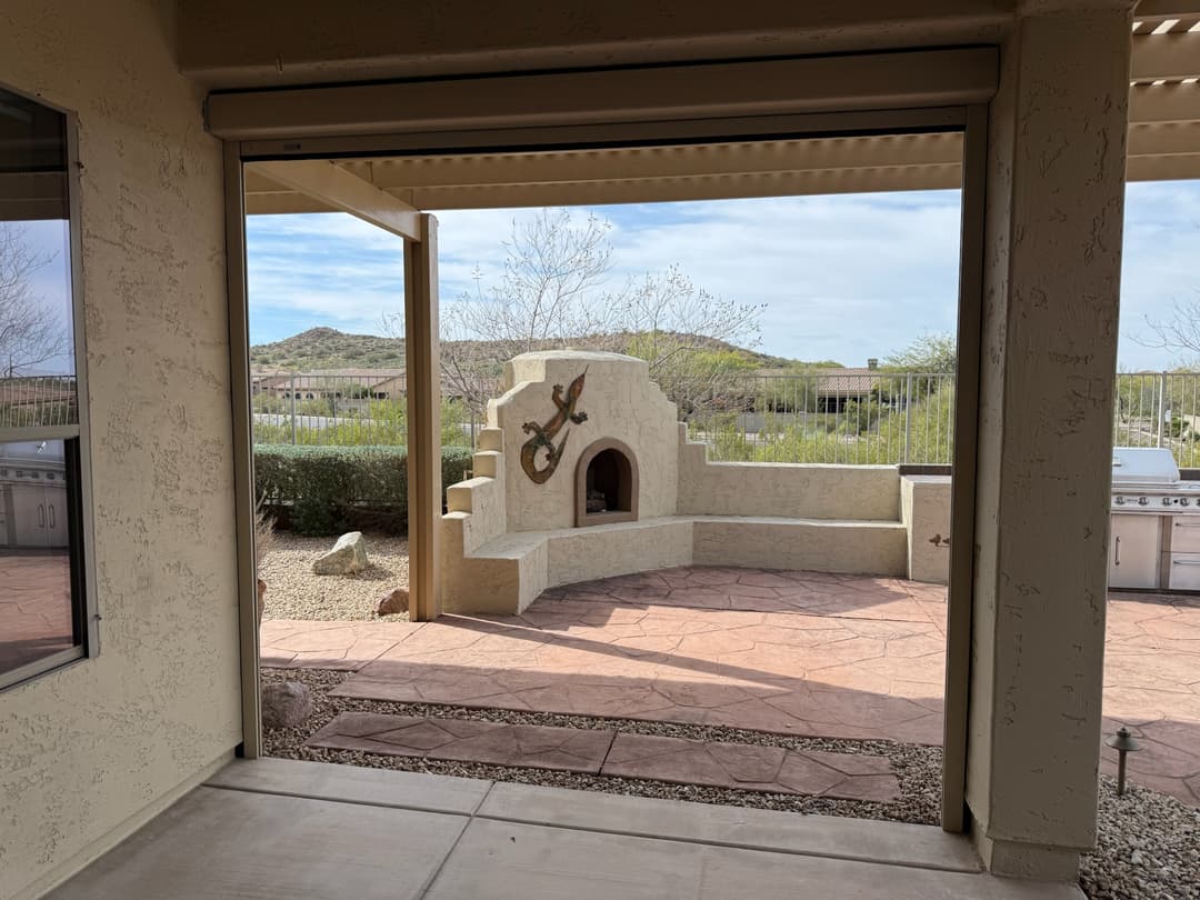 A unique patio with aesthetic drop shades protecting from the harsh Phoenix AZ sun