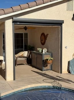 Poolside drop shade raised on a Phoenix patio