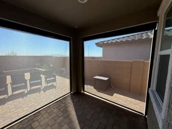 Interior patio view through a privacy shade on the same Phoenix home