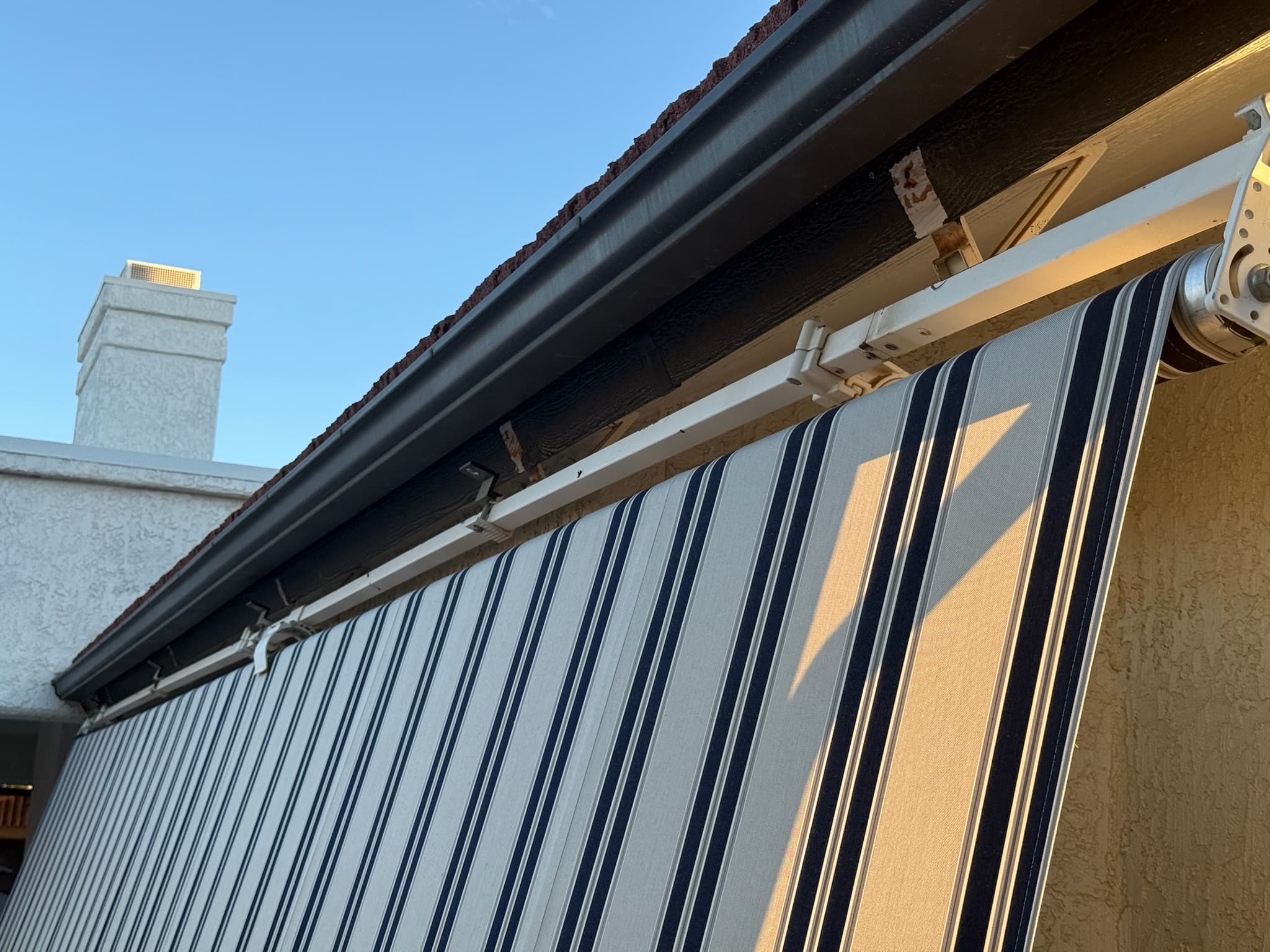 Damaged awning before repair