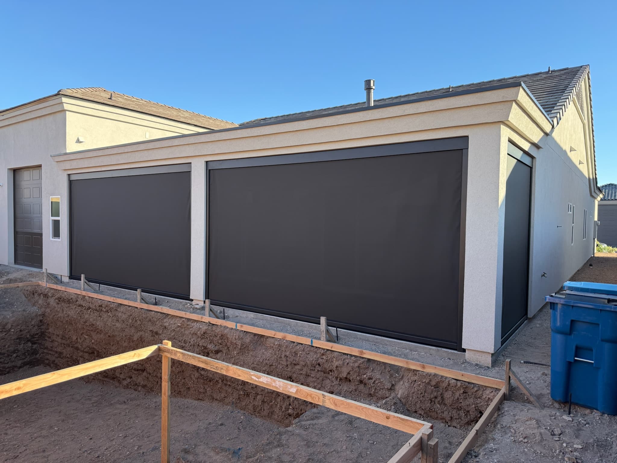 Exterior roll shades lowered on a Phoenix area patio