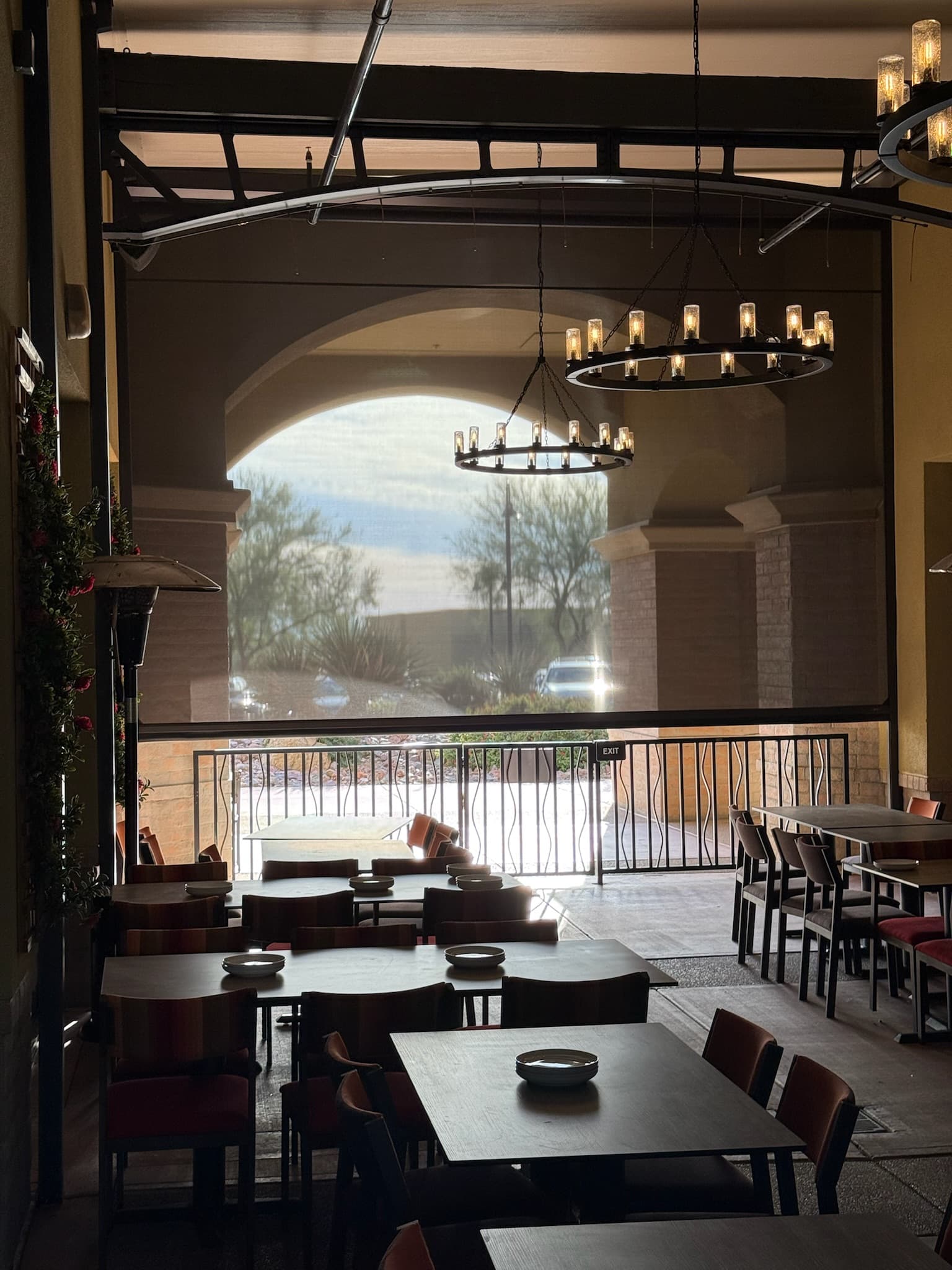 Large restaurant screen shade protecting patio dining in Phoenix