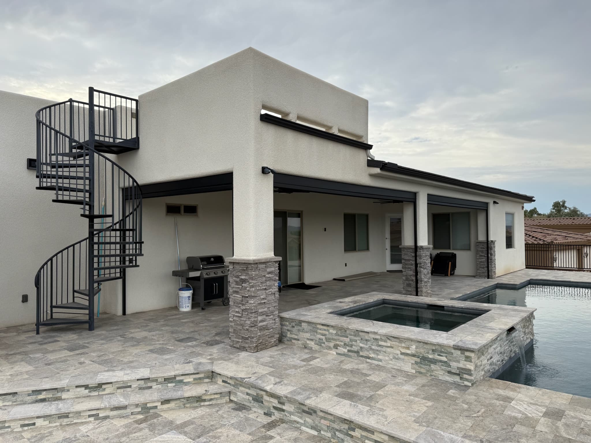 Exterior shades raised on the same Phoenix pool patio